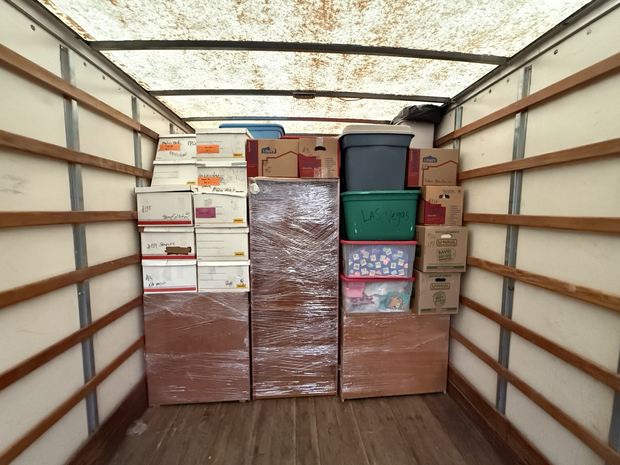 Boxed items arranged inside the moving truck