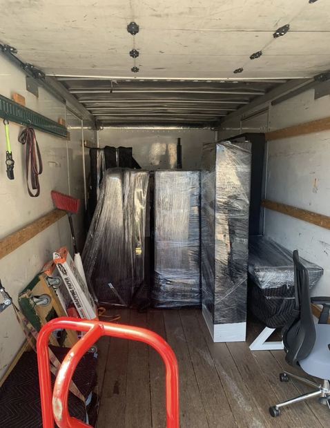Wrapped furniture prepared for loading